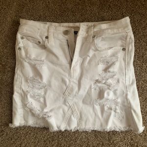 Stretchy white distressed mini skirt